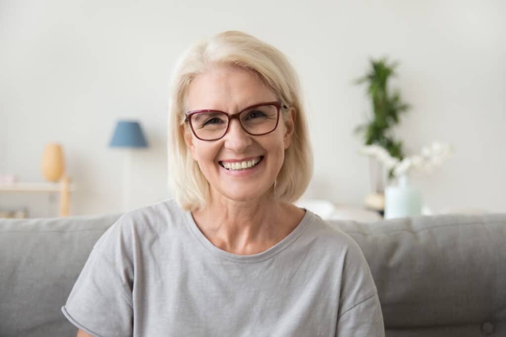 Smiling,Middle,Aged,Mature,Grey,Haired,Woman,Looking,At,Camera,